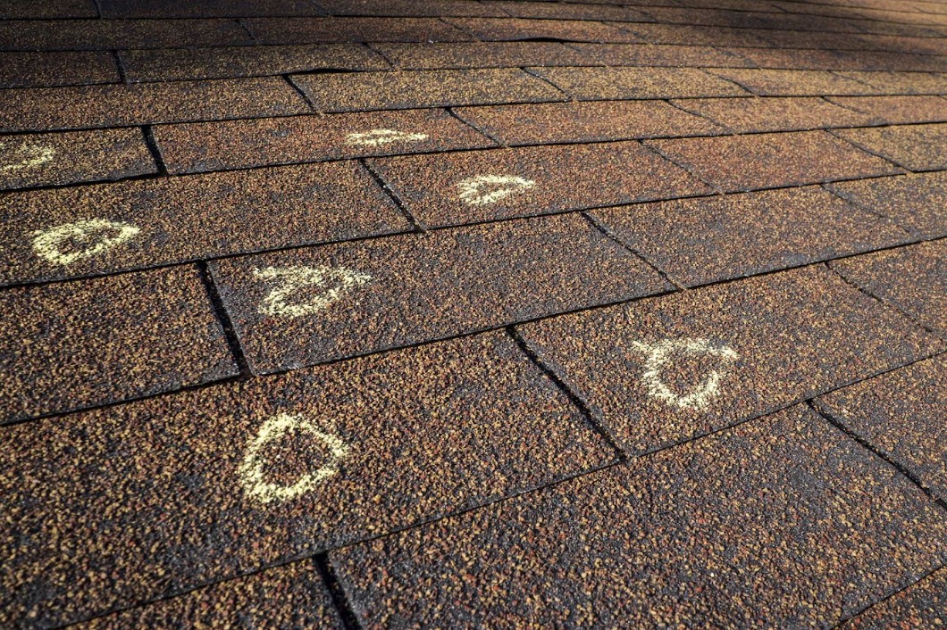 spot wind and hail damage on roof in West Central Indiana